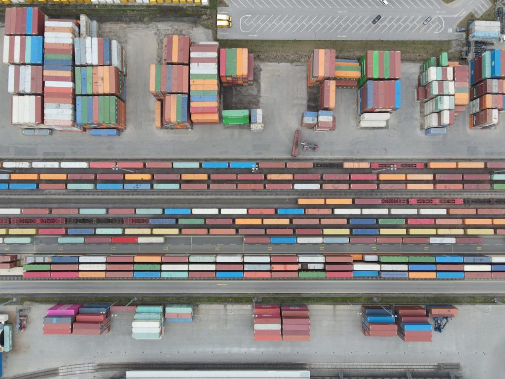 Aerial shot of stacked cargo containers at Regensburg port showcasing freight transport activity.